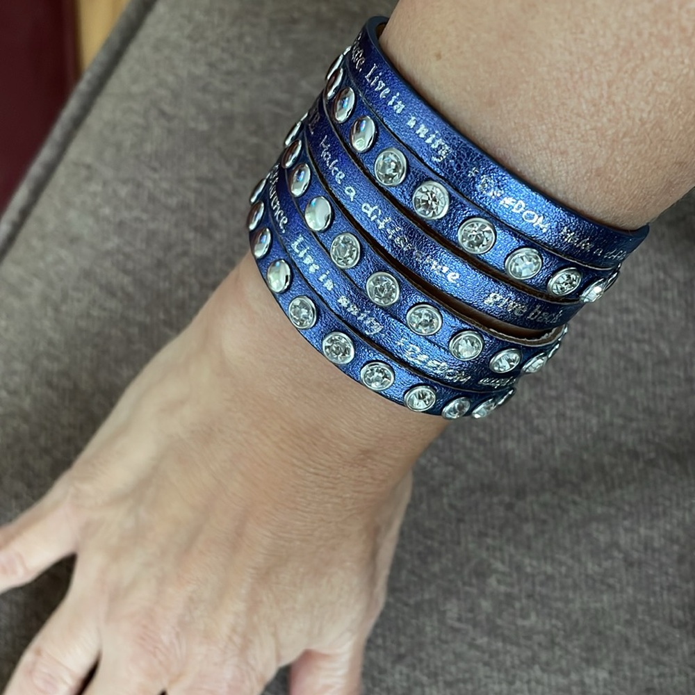 Humanity Bracelet purple with crystals/studs. Kindness writing on it